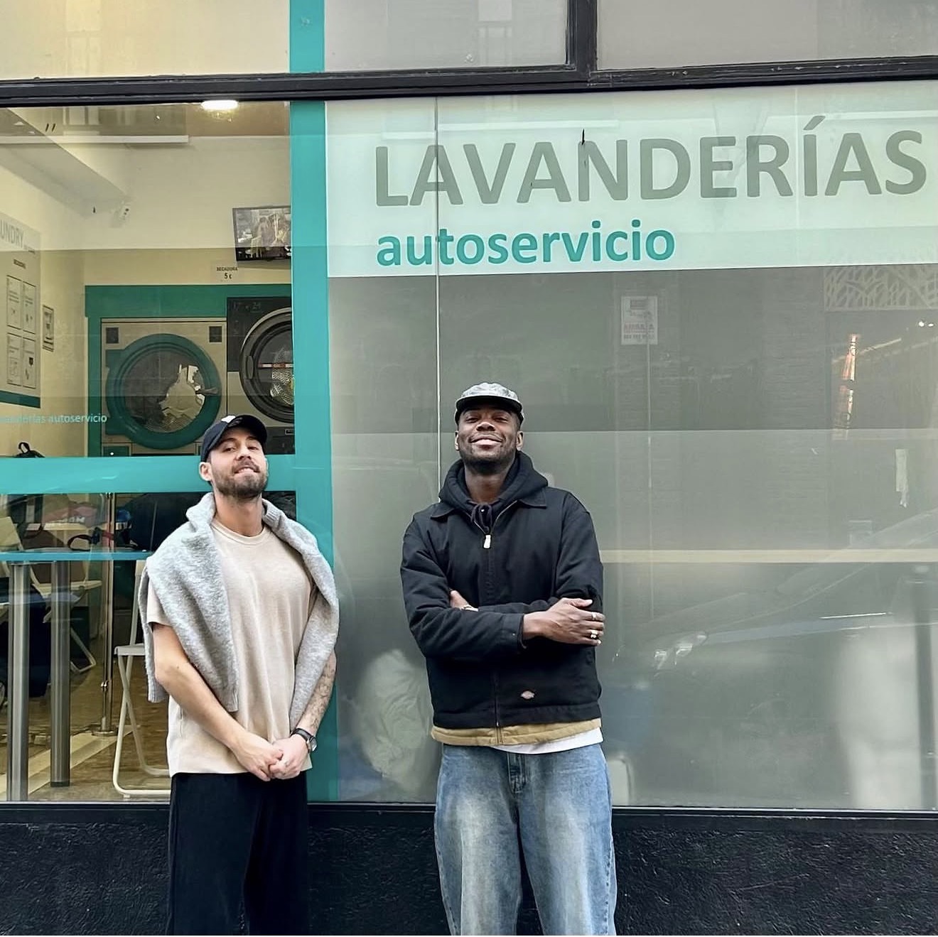 Kefil & Cram in front of a launderette